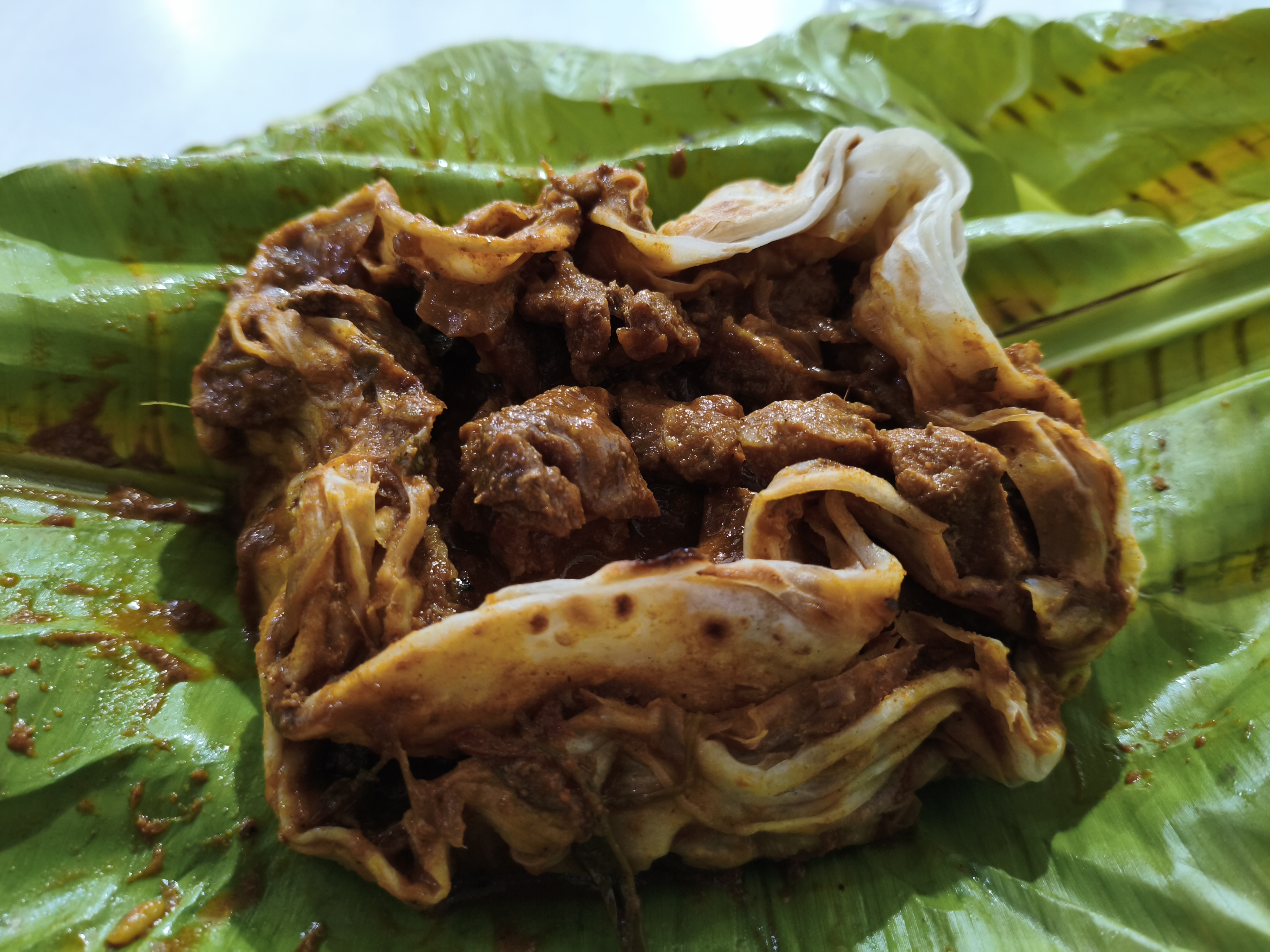 Kizhi Porotta (Banana Leaf Special)